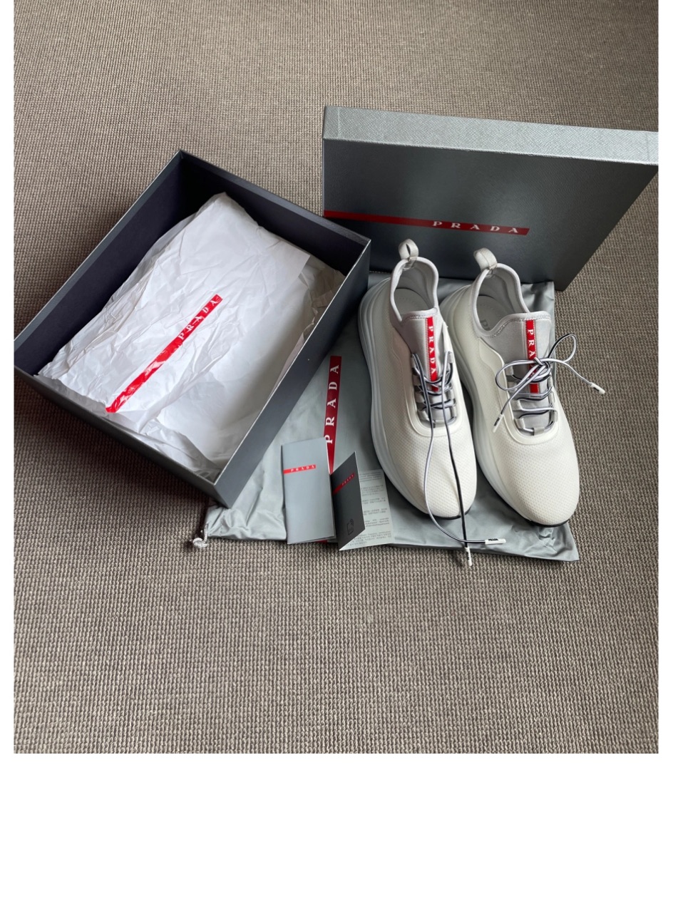 Prada Men’s White Sneakers With Red Logo Stripe